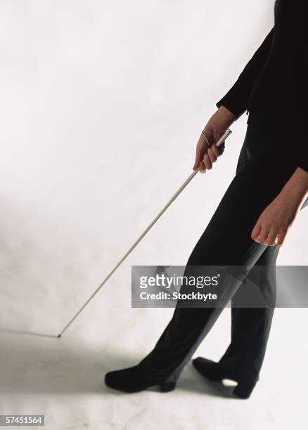 close-up of a man using a walking cane - blind white background stock pictures, royalty-free photos & images