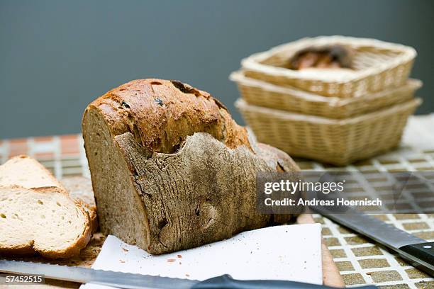 bread and knife on table - moldy bread stock pictures, royalty-free photos & images