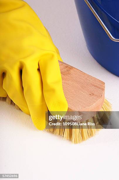 person scrubbing surface, close-up - scrubbing brush stock pictures, royalty-free photos & images