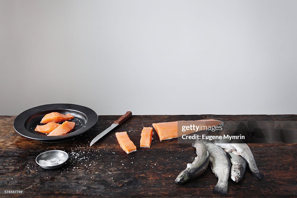 Raw fish on table