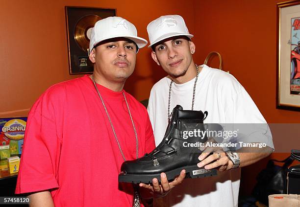 Recording artists Khriz and Angel pose at the celebrity gift retreat presented by Backstage Creations for the 2006 Premios Billboard at Seminole Hard...