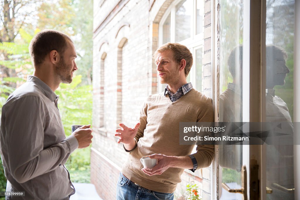 Two designers relaxing in their studio.