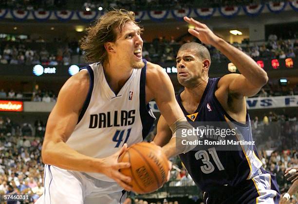Dirk Nowitzki of the Dallas Mavericks drives the ball against Shane Battier of the Memphis Grizzlies in game two of the Western Conference...