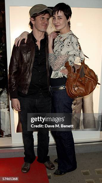 Erin O'Connor and her partner John Kent attend the private view for 'Look At Me - A Retrospective', a new photographic exhibition by celebrity...