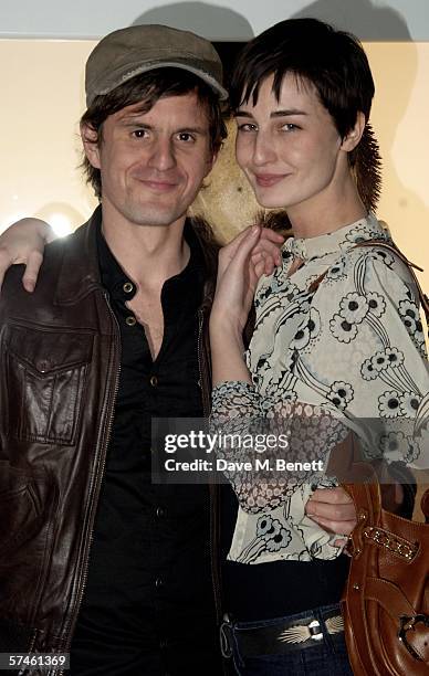 Erin O'Connor and her partner John Kent attend the private view for 'Look At Me - A Retrospective', a new photographic exhibition by celebrity...