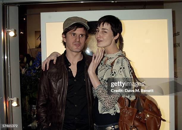 Erin O'Connor and her partner John Kent attend the private view for 'Look At Me - A Retrospective', a new photographic exhibition by celebrity...