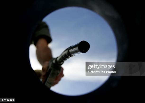 In this photo illustration a petrol pump is seen April 27, 2006 in Auckland, New Zealand. Petrol prices have risen again for the fourth time in less...