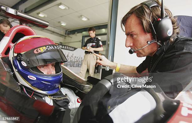 Eddie Cheever of the USA talks to his engineer during second practice prior to the Grand Prix Masters race at the Losail International Circuit on...
