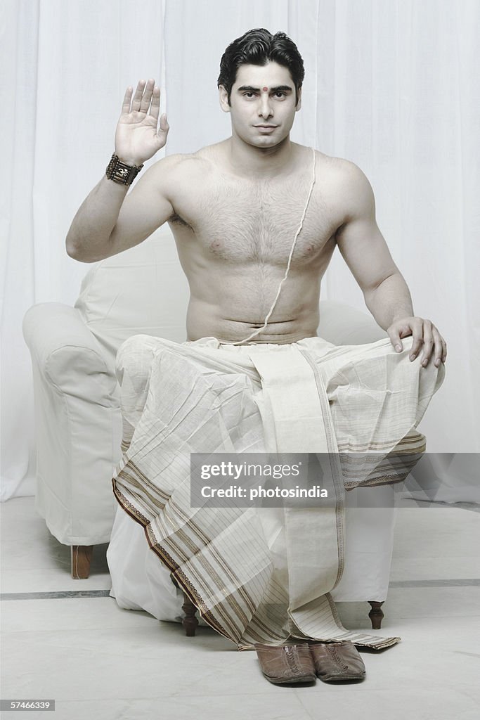 Portrait of a young man gesturing