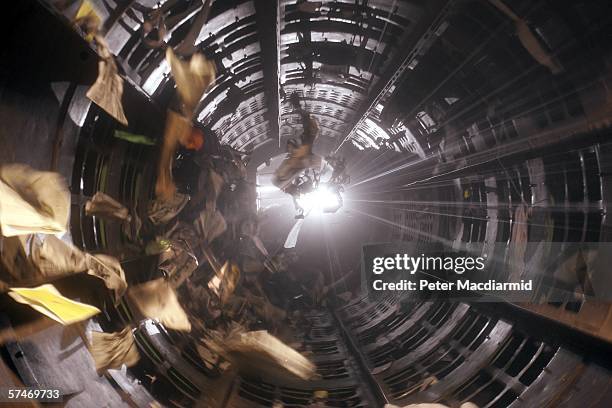 Rotating cylindrical sorting tunnel called the 'Trommel' sorts waste into three sizes for hand separating at the Materials Recovery Facility on April...
