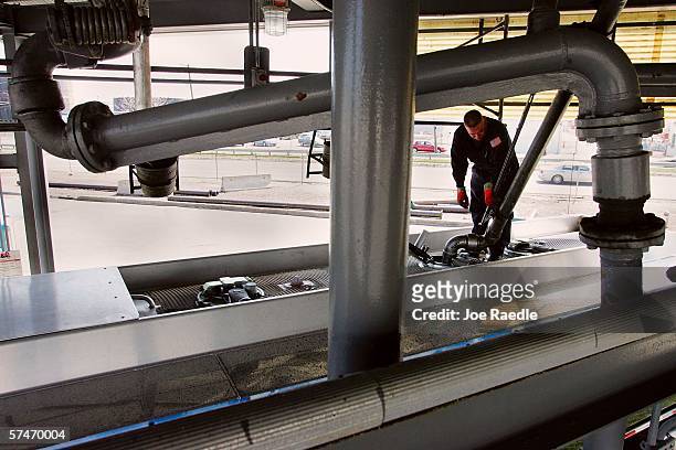 Joel Castanaca loads diesel fuel from the truck rack into his delivery truck at the Global Petroleum facility April 27, 2006 in Boston,...