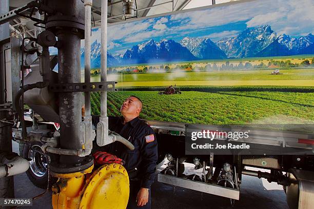 Joel Castanaca prepares to fill his delivery truck up with diesel fuel from the truck rack at the Global Petroleum facility April 27, 2006 in Boston,...