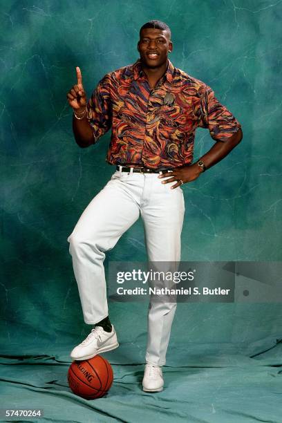 Larry Johnson poses for a portrait after being selected number one overall in the 1991 NBA Draft by the Charlotte Hornets on June 26, 1991 in New...