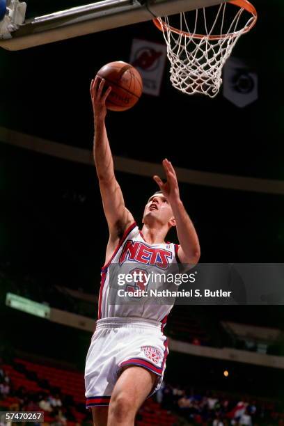 Drazen Petrovic of the New Jersey Nets shoots a layup during a game played in 1991 at the Brendan Byrne Arena in East Rutherford, New Jersey. NOTE TO...