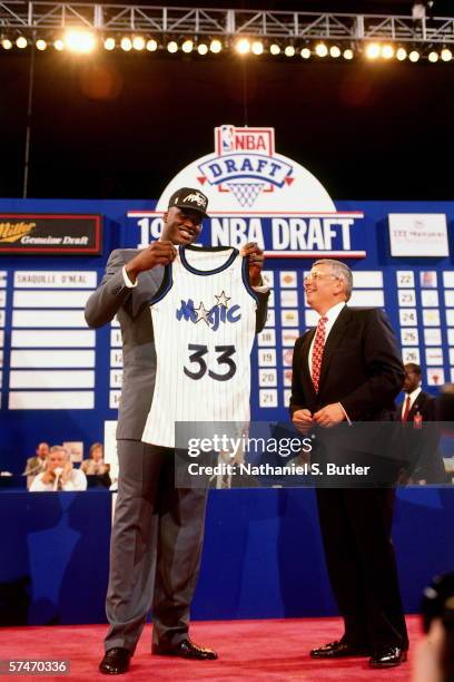 Shaquille O'Neal poses with the Orlando Magic uniform with NBA Commissioner David Stern after being selected number one overall by the Orlando Magic...