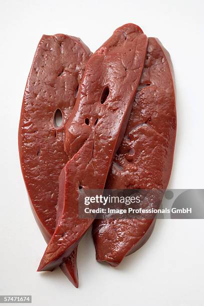 three slices of calf's liver - beef liver stock pictures, royalty-free photos & images