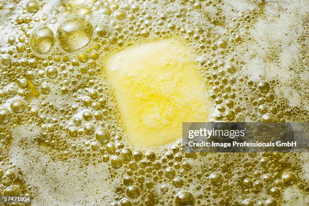 heating butter and oil in frying pan - frying pan stock pictures, royalty-free photos & images