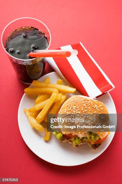 cheeseburger, bites taken, with chips and cola - missing bite stock pictures, royalty-free photos & images