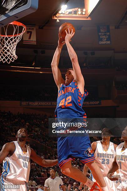 David Lee of the New York Knicks goes to the basket against the Denver Nuggets at Madison Square Garden on March 13, 2006 in New York, New York. The...
