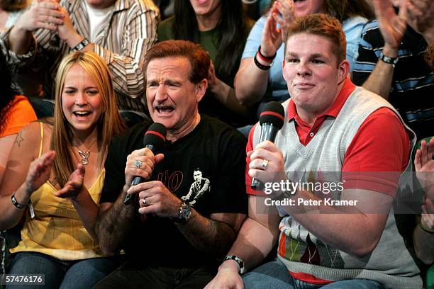 Actor Robin Williams sits onstage with the audience during MTV's Total Request Live at the MTV Times Square Studios on April 27, 2006 in New York...