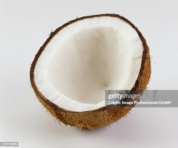 half a coconut - coconut isolated stock-fotos und bilder