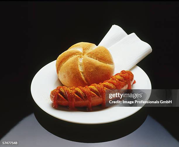 bratwurst with ketchup and a roll - currywurst stock pictures, royalty-free photos & images