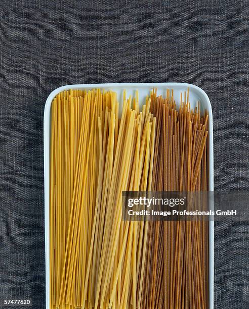 spaghetti, spaghetti alla chitarra & wholemeal spaghetti - chitarra stock pictures, royalty-free photos & images