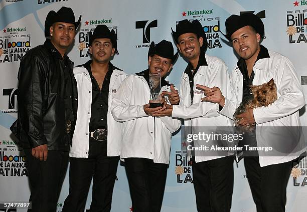 Members of the group Patrulla 81 pose with their award for Regional Mexican Airplay Song Of The Year in the press room at the 2006 Billboard Latin...