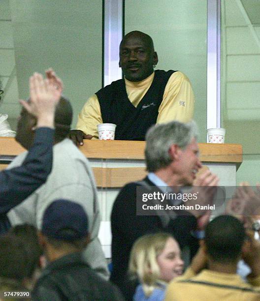 Fans cheer for former Bull Michael Jordan , who watches from a luxury suite, as the Chicago Bulls take on the Miami Heat in game three of the Eastern...