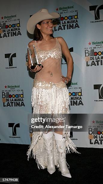 Singer Diana Reyes poses with her award for Regional Mexican Album Of The Year in the press room at the 2006 Billboard Latin Music Awards at the...