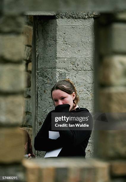 Girl weeps on the site which was formerly the Broad Arrow cafe during a commemoration service to mark the 10th aniversary of the massacre April 28,...