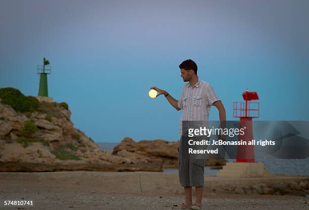 man and the moon in spain - jc bonassin stockfoto's en -beelden