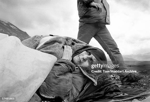 An old woman rests after crossing the border between Kosovo and Albania after being forced to flee her home by Serb forces during the spring of 1999.