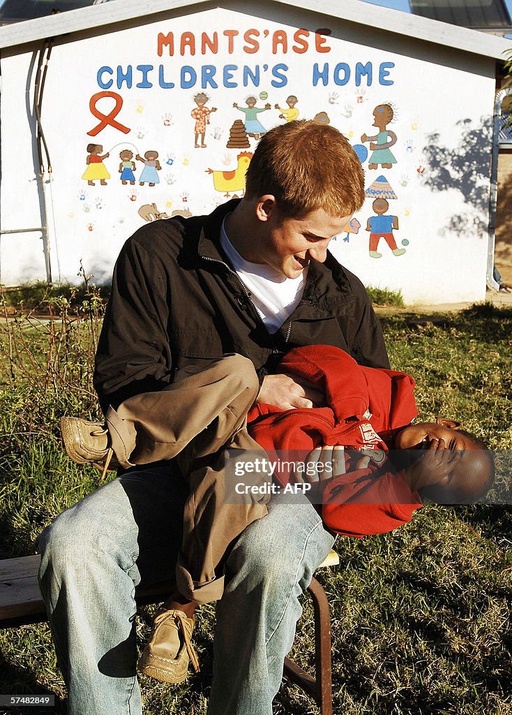 Britain's Prince Harry plays with his ol