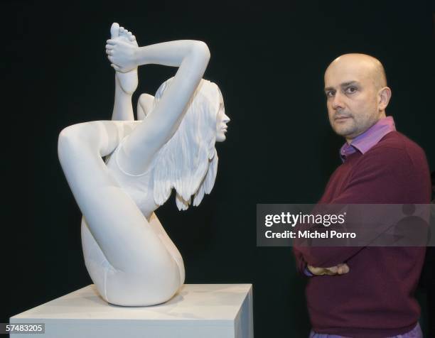 Artist Marc Quinn stands with his new piece called 'Sphinx' which is a sculpture of supermodel Kate Moss in a yoga position, on April 28, 2006 in...