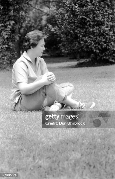 Portrait of American novelist Harper Lee as she sits on the grass, Monroeville, Alabama, May 1961. Lee's novel 'To Kill a Mockingbird' was award the...