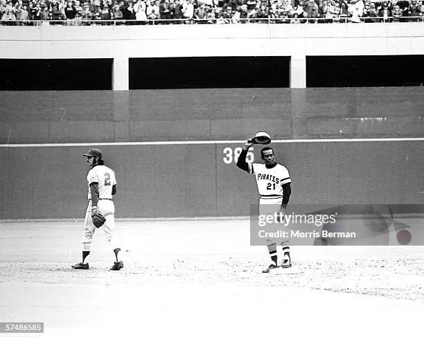 Roberto Clemente of the Pittsburgh Pirates is shown tipping his hat after collecting career hit number 3 his last regular season hit ever, against...