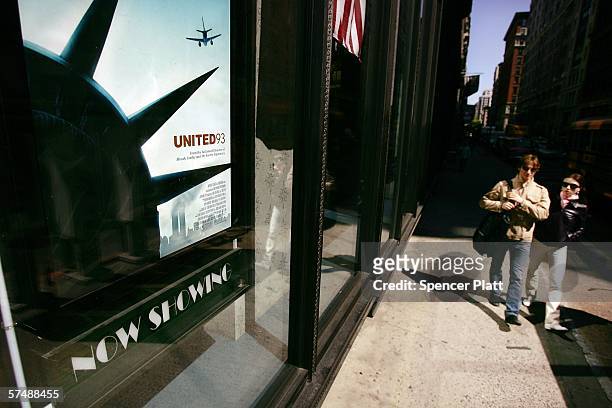 Pedestrians walk past an advertisment for the new film "United 93" April 28, 2006 in New York City. "United 93" by Paul Greengrass, is a drama about...