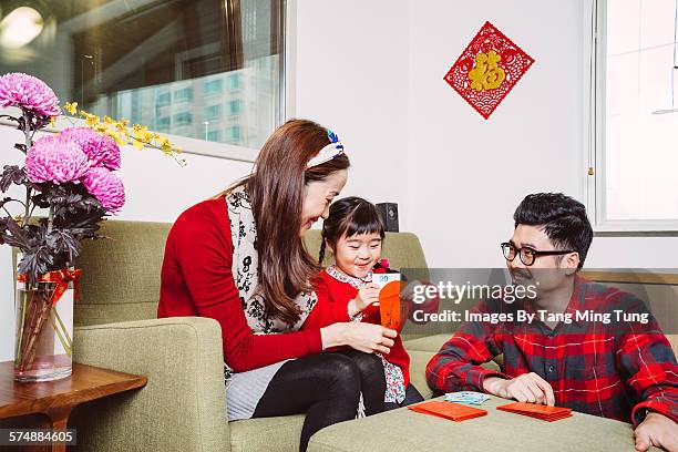 littl girl preparing chinese new year with parent - chinese prepare for lunar new year stock pictures, royalty-free photos & images