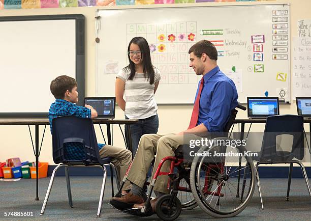 teacher with disability in classroom. - system demonstration stock pictures, royalty-free photos & images