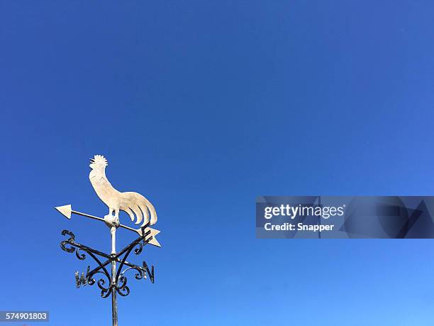 weather vane against a clear blue sky - weather vane stock pictures, royalty-free photos & images