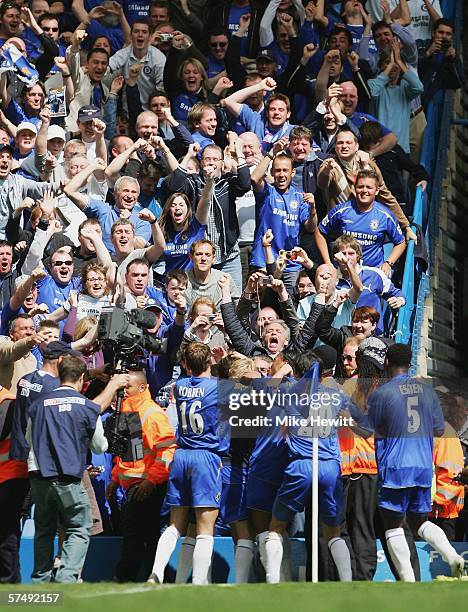 Joe Cole of Chelsea is surrounded by celebrating team mates after scoring the second goal during the Barclays Premiership match between Chelsea and...