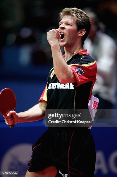 Bastian Steger of Germany celebrates his victory and the third winning point against Russia during the sixth day of the Liebherr World Team Table...