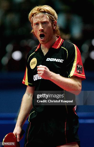 Christian Suss of Germany celoebrates his victory against Alexei Smirnov of Russia during the sixth day of the Liebherr World Team Table Tennis...
