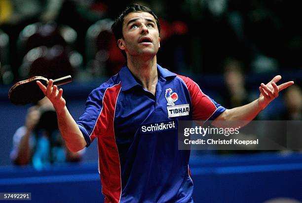 Damian Eloi of France is thoughtful during his match against Wang Liqin of China during the sixth day of the Liebherr World Team Table Tennis...