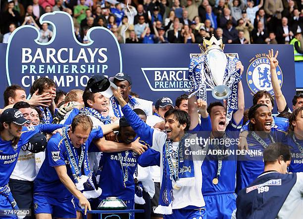 London, UNITED KINGDOM: Chelsea's Captain John Terry lifts the Premiership trophy alongside teammates after defeating Manchester United to win the...
