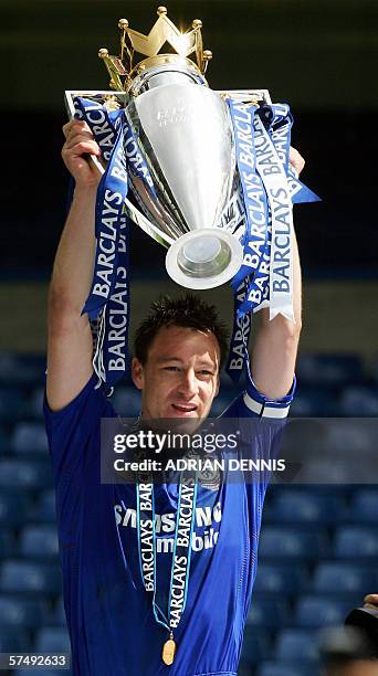 London, UNITED KINGDOM: Chelsea's Captain John Terry lifts the Premiership trophy during the celebrations after defeating Manchester United to win...