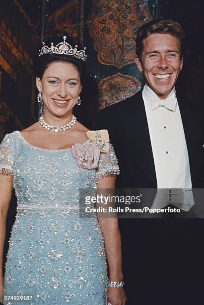Princess Margaret, Countess of Snowdon posed, wearing a tiara, with her husband, Antony Armstrong-Jones, 1st Earl of Snowdon at a ball in Washington...