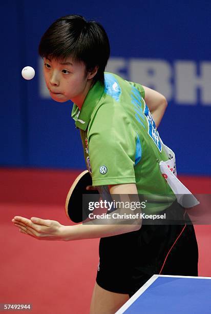 Yining Zhang of China serves against Veronika Pavlovich of Belarus in the women half-final during the sixth day of the Liebherr World Team Table...