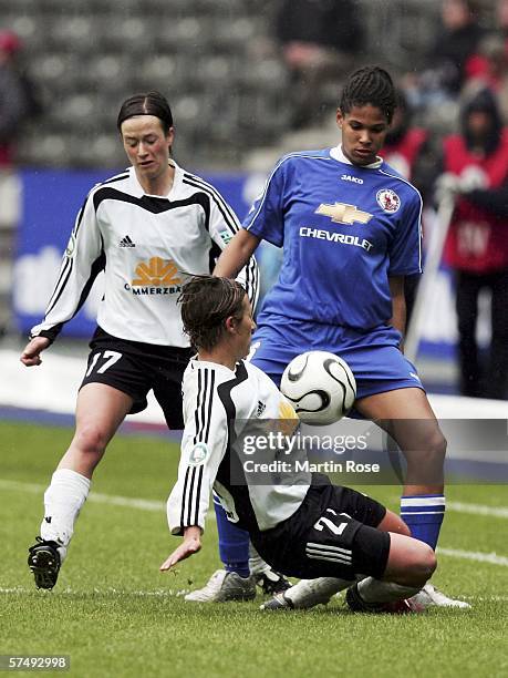 Navina Omilade of Potsdam challenges Judith Affeld and Sandra Albertz of Frankfurt during the Women's DFB German Cup final between 1.FFC Turbine...